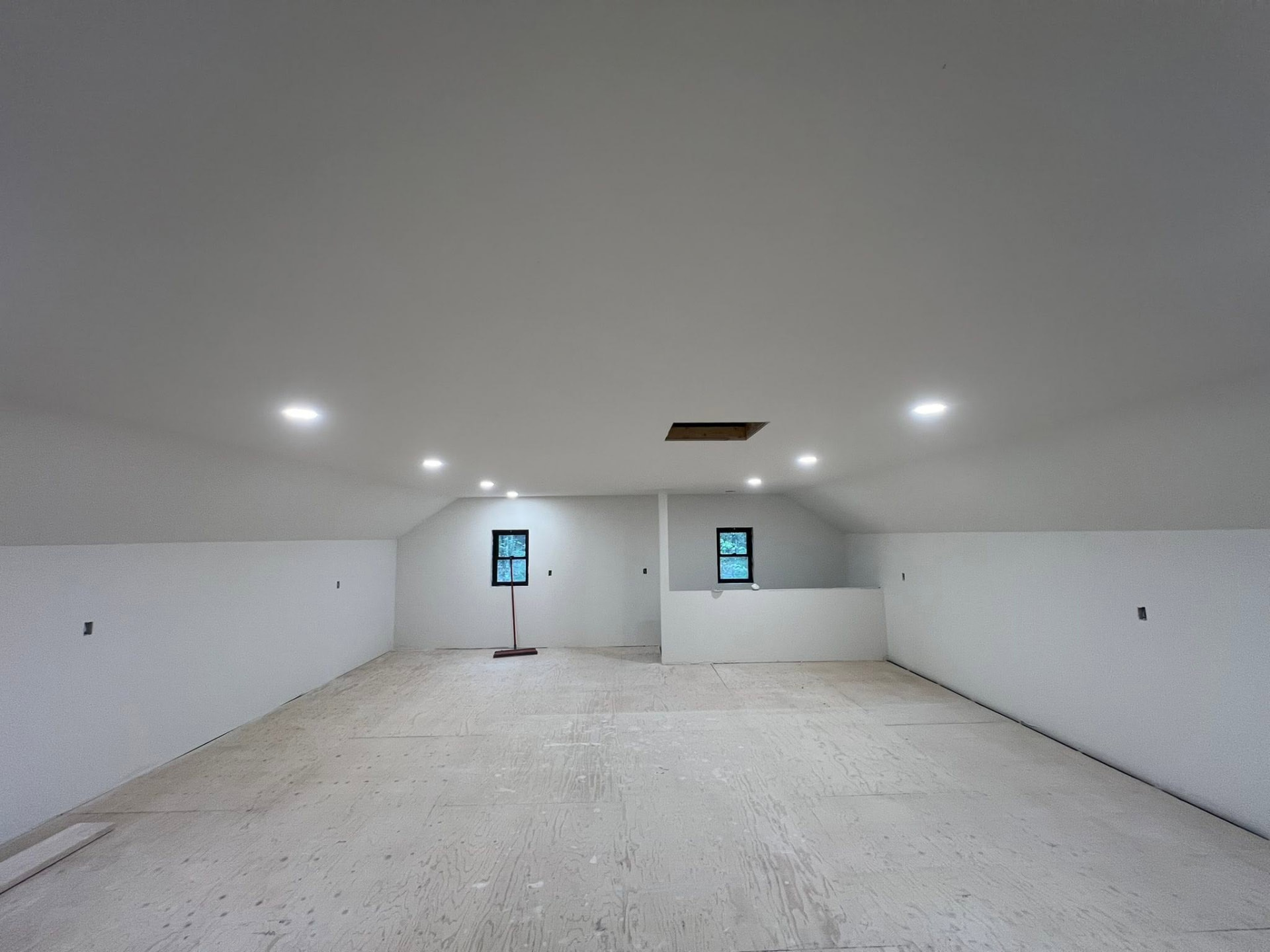 New construction upper-level interior with smooth finished walls and ceiling